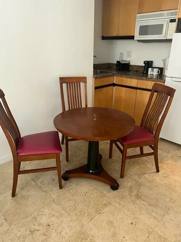 Before — Bentley Hotel South Beach dining nook and kitchenette prior conditions