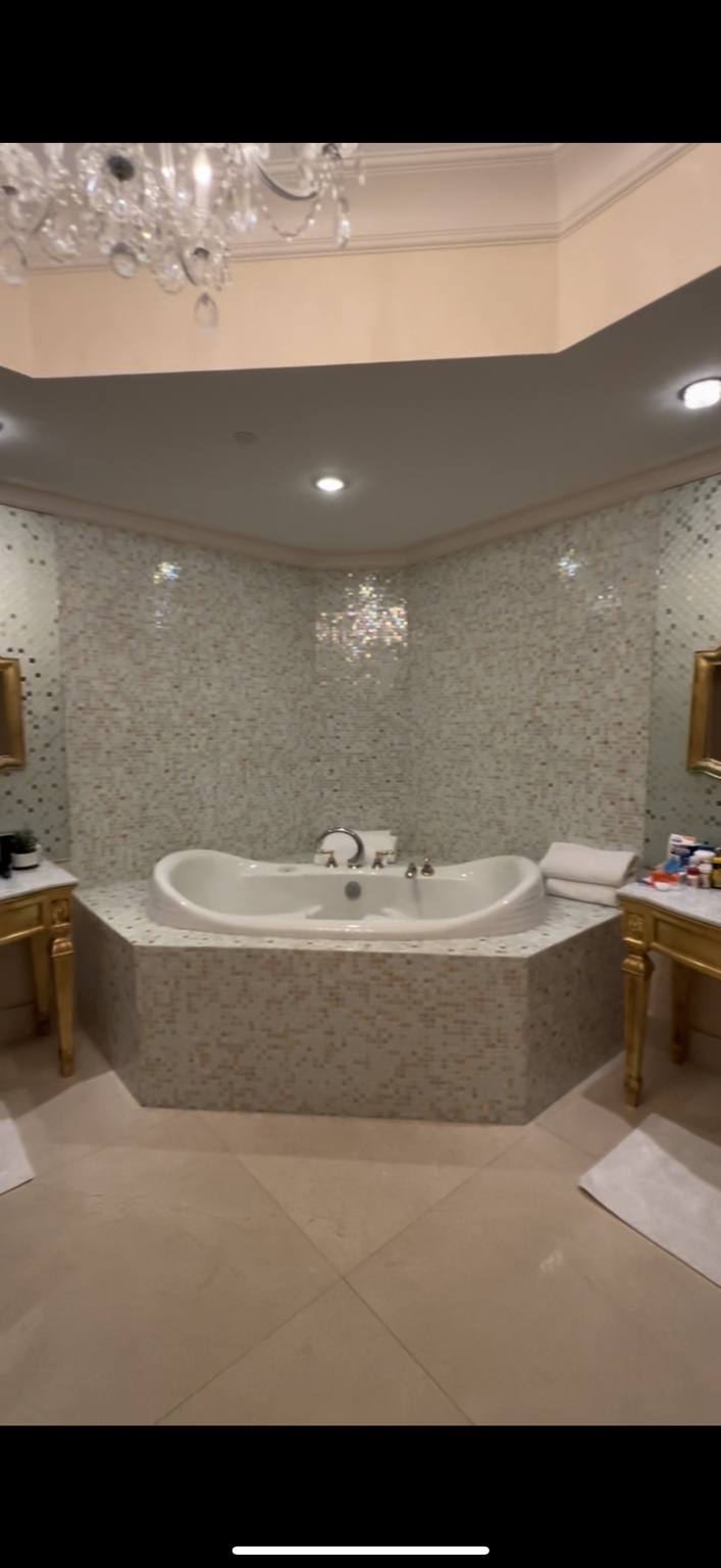Before renovation: original closet and storage area adjacent to kitchen at Fisher Island residence prior to IV Atelier redesign
