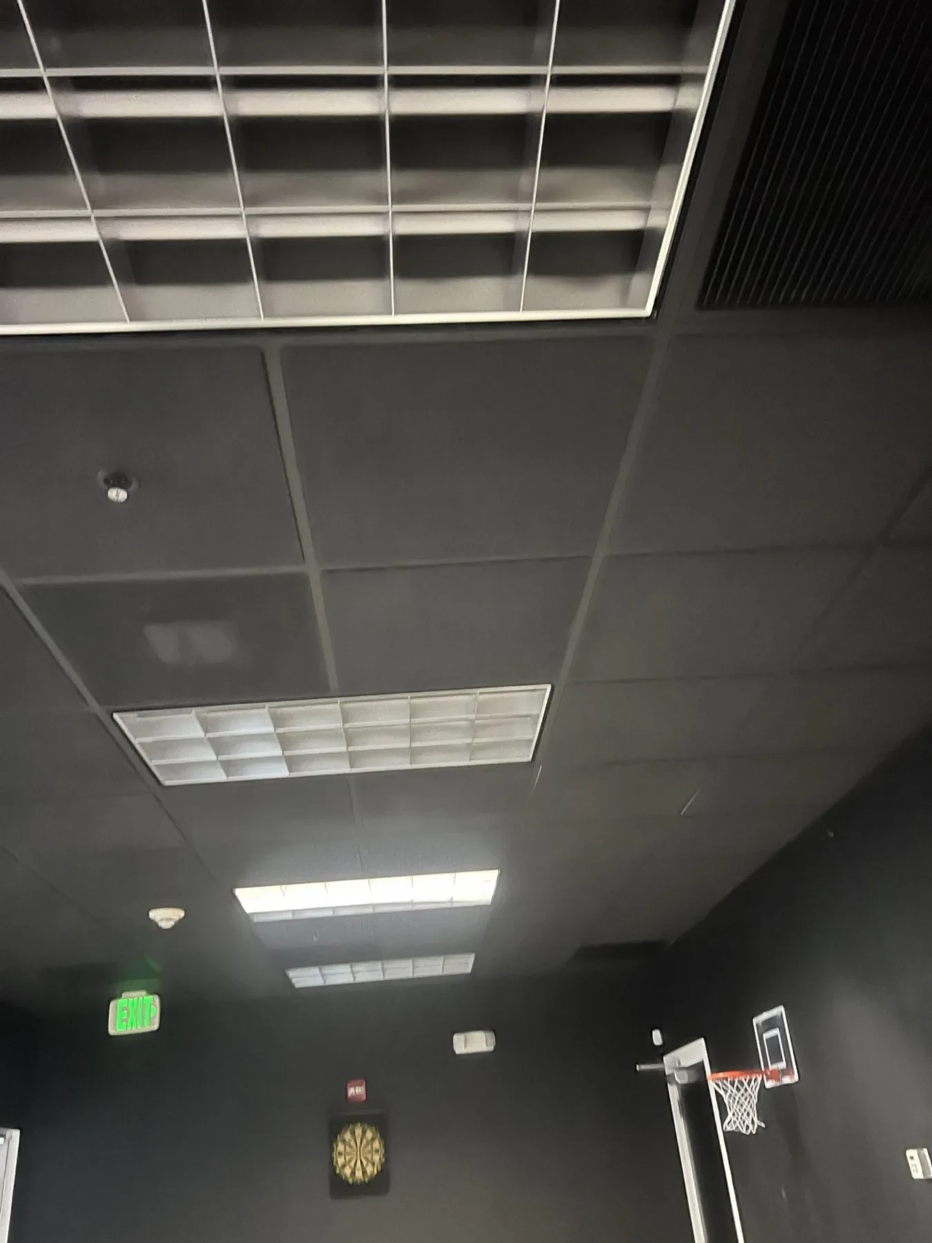 Before — existing ceiling with fluorescent lighting.