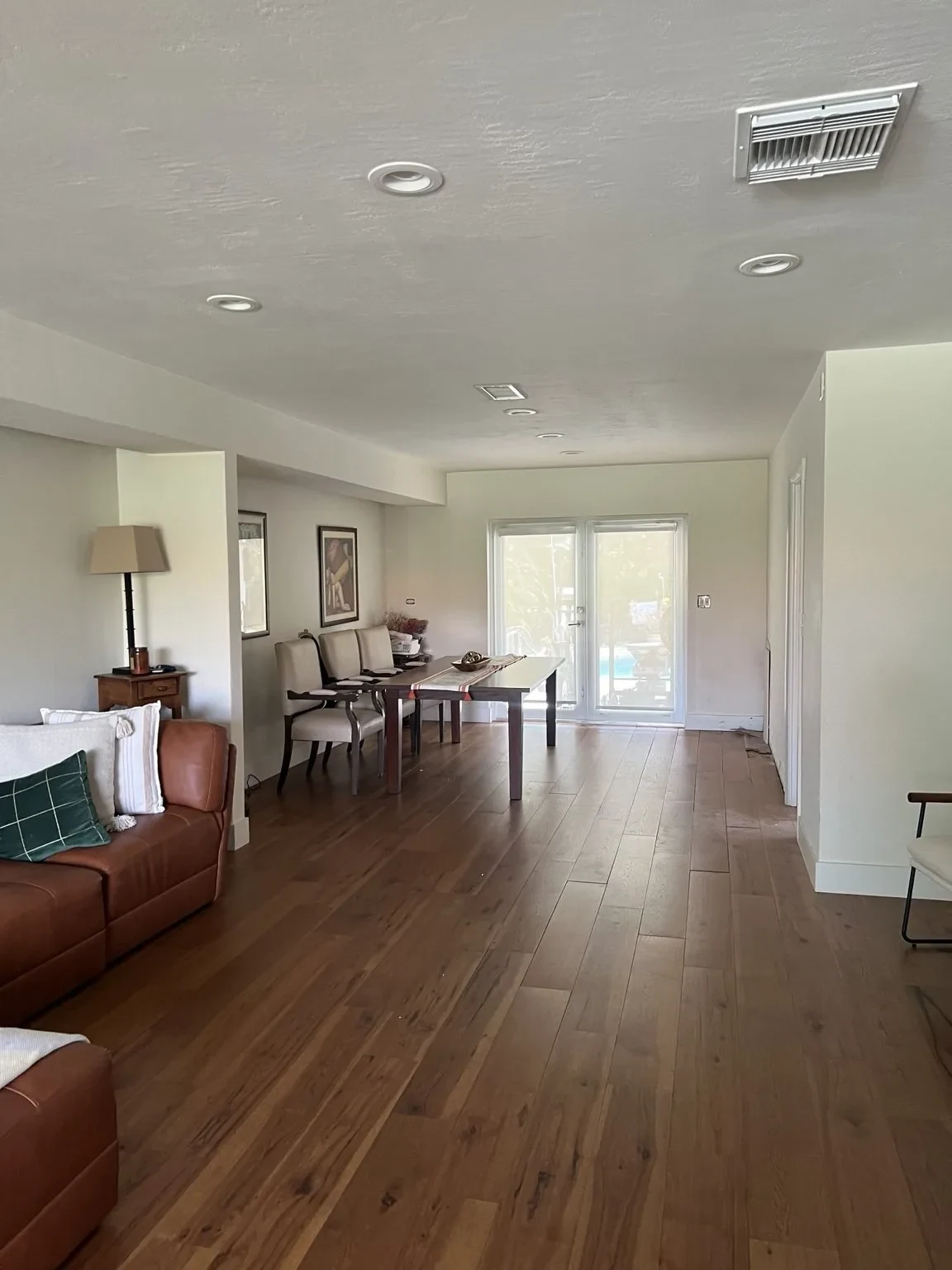 Before — original open-plan living and dining prior to renovation.