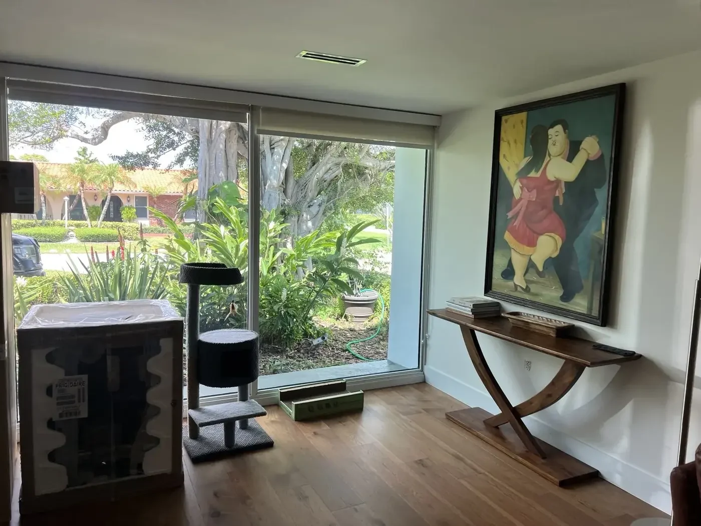 Before — mid-renovation with new windows and Botero painting.