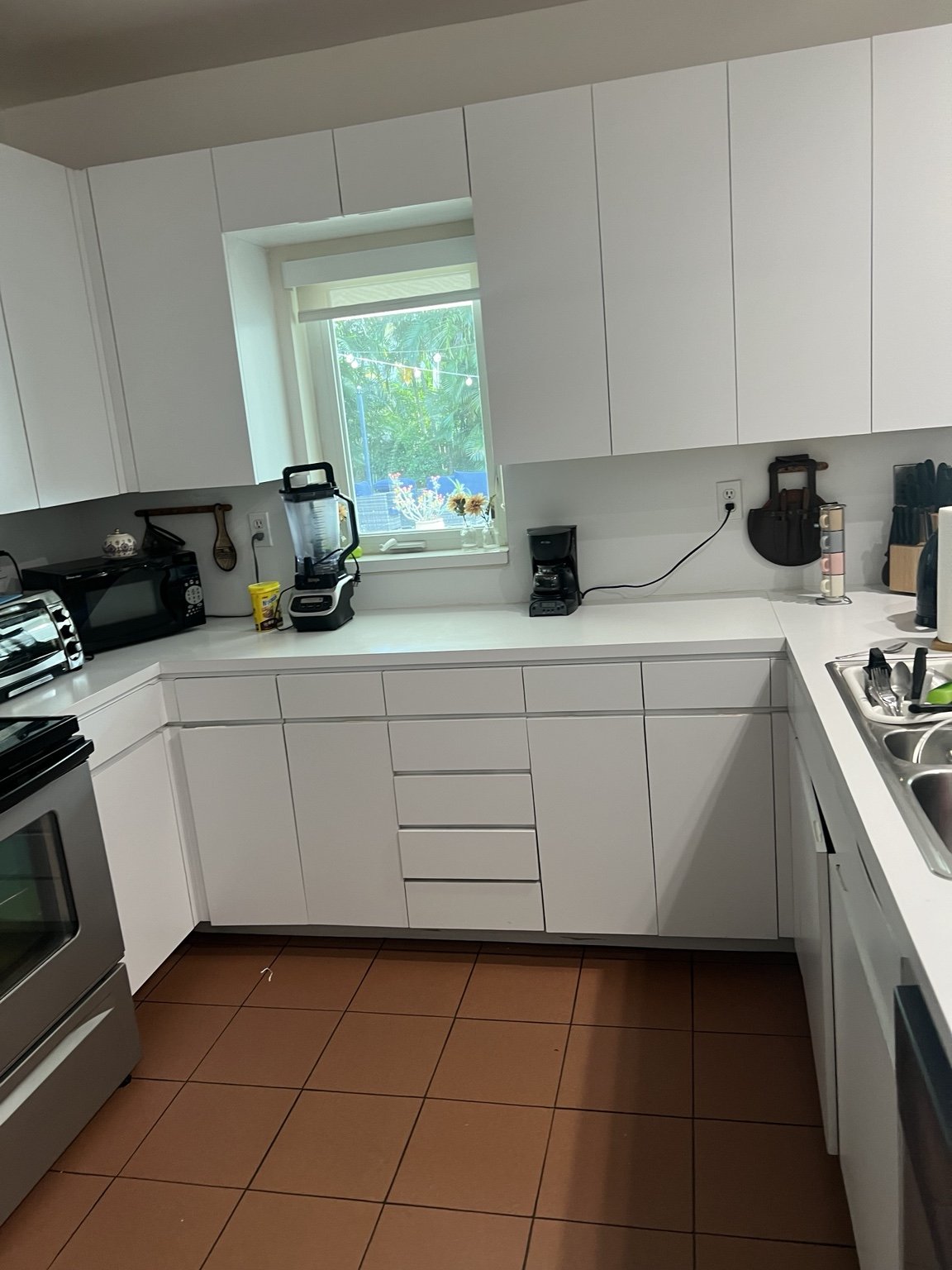 Before — original dining area with round granite table.
