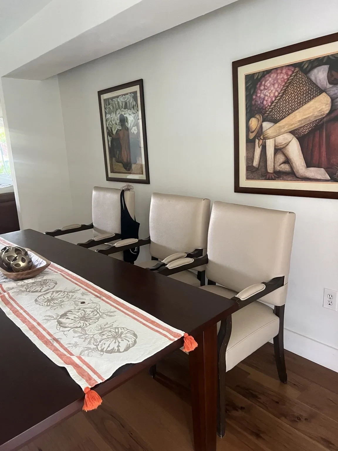 Before — original dining room with existing artwork.