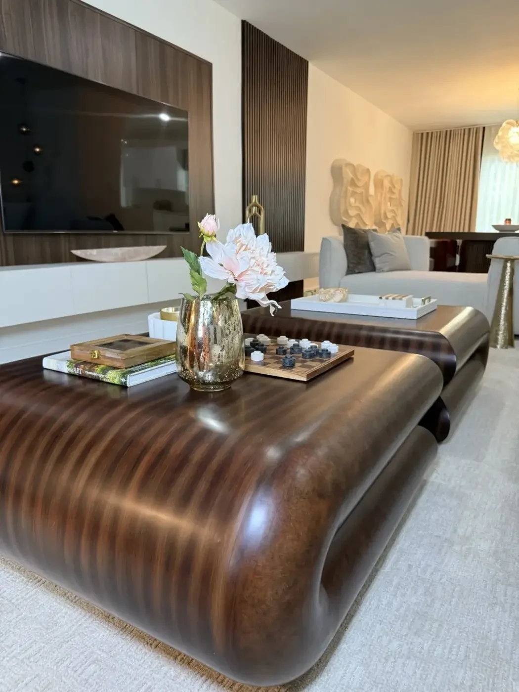 San Souci Residence — coffee table detail with checkerboard game and flowers.